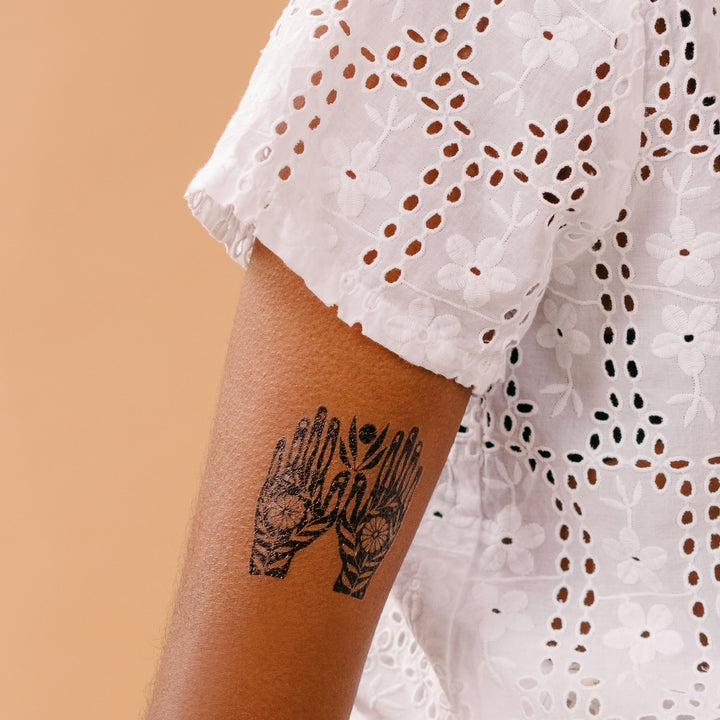 Tattly Growth In Your Hands Tattoo